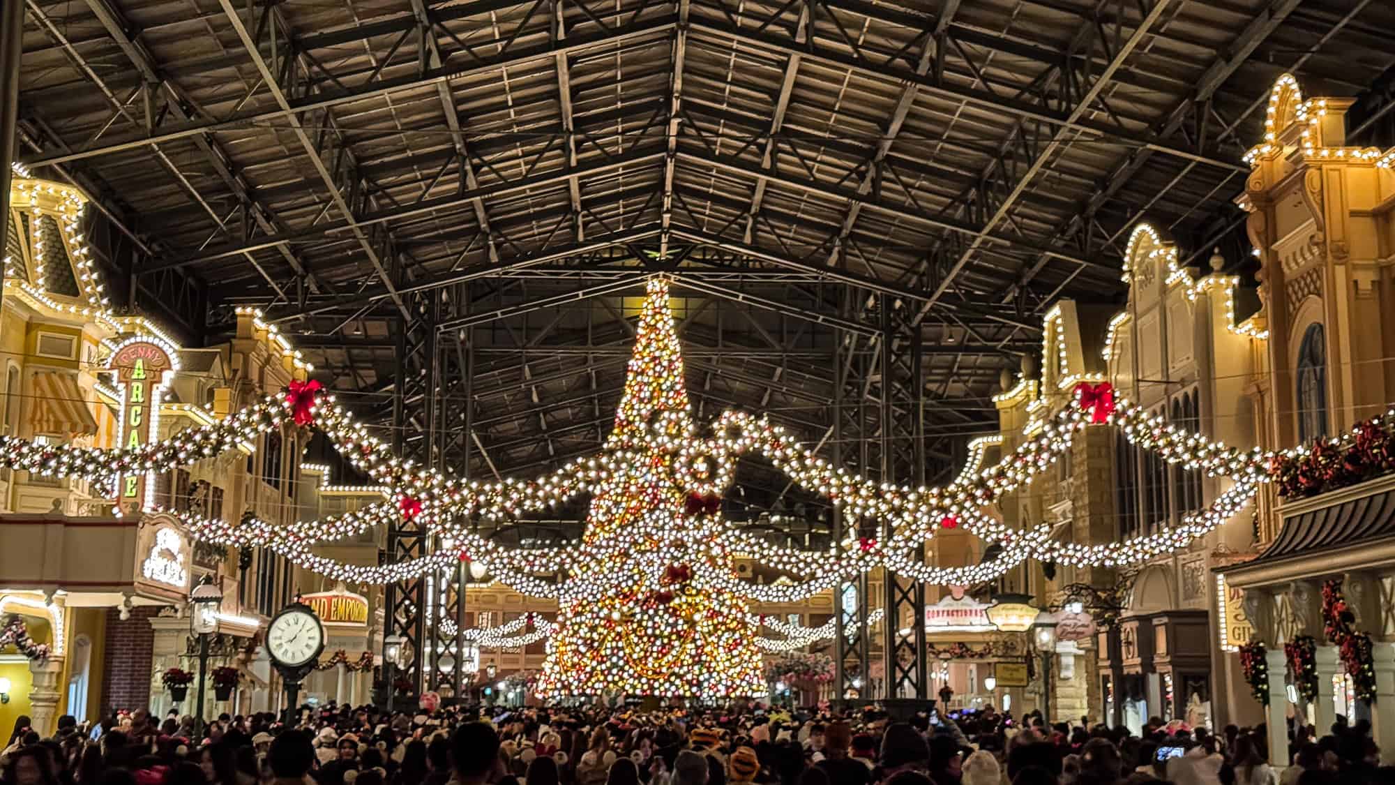 Christmas tree lit up at night in World Bazaar in Tokyo Disneyland, Japan.